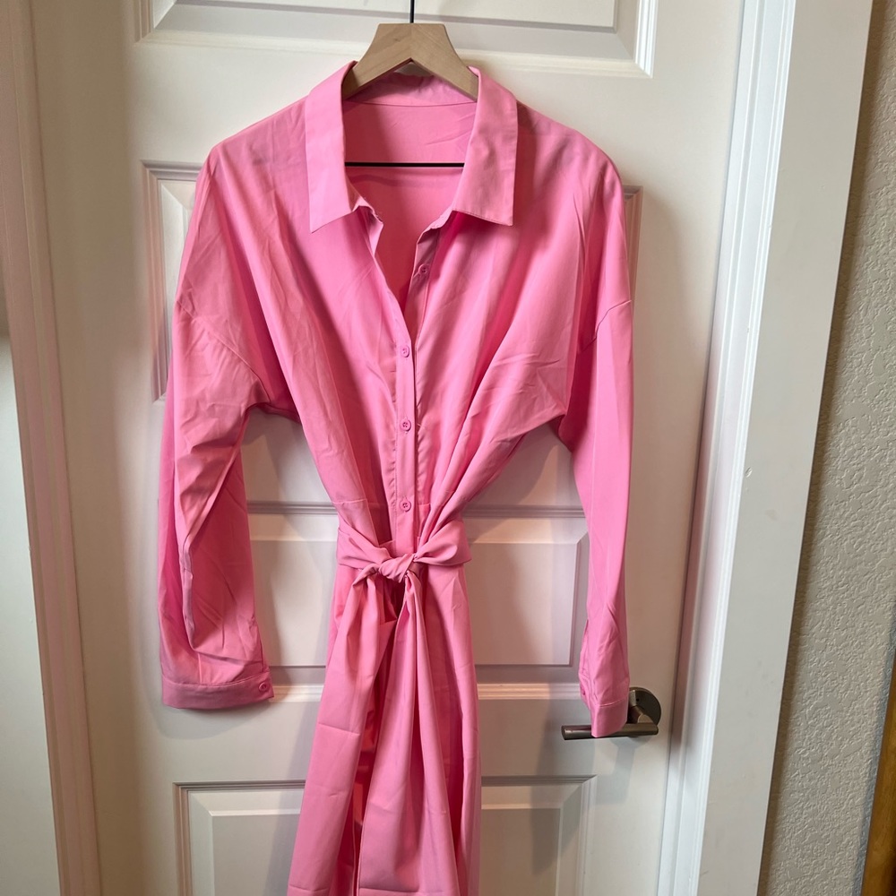 Pink, button up, long sleeve, tie waist belt. XL Never worn. Polyester